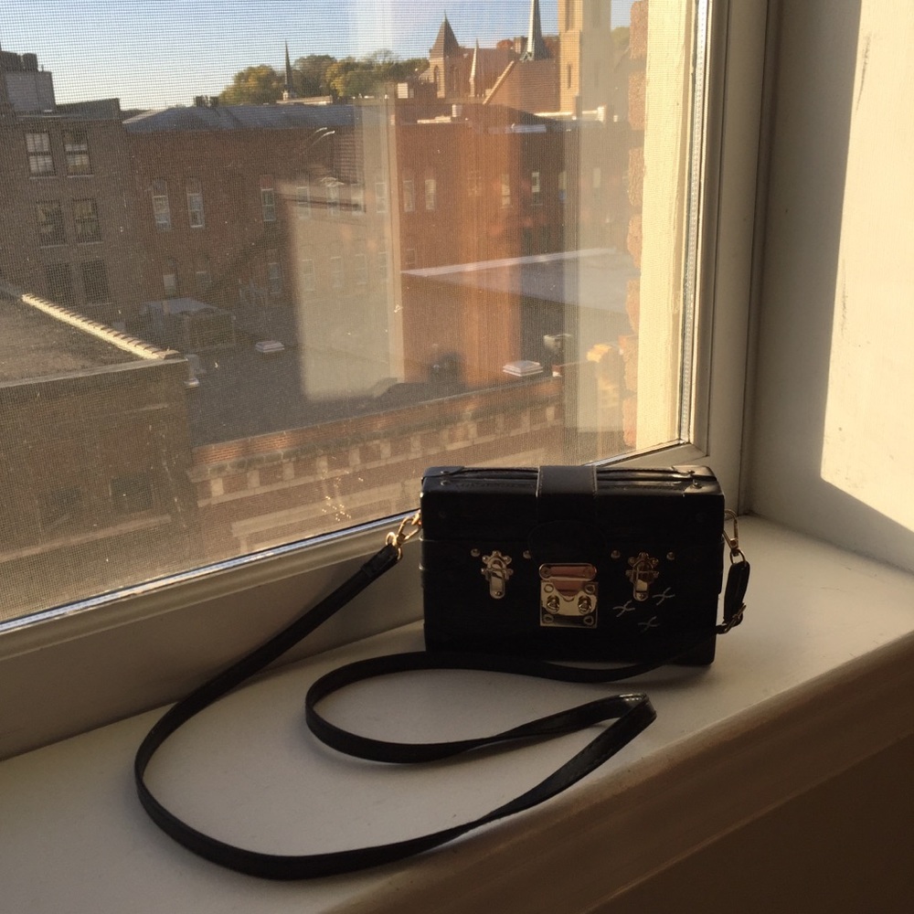 Mini black and gold luggage crossbody bag